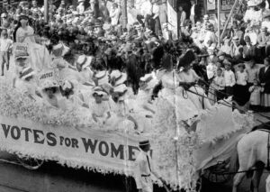 Eva McCall Hamilton and Ethelyn Haines at the helm of the Grand Rapids Equal Franchise Club float at the 1910 Grand Rapids Homecoming Parade, Bentley Historical Library. 